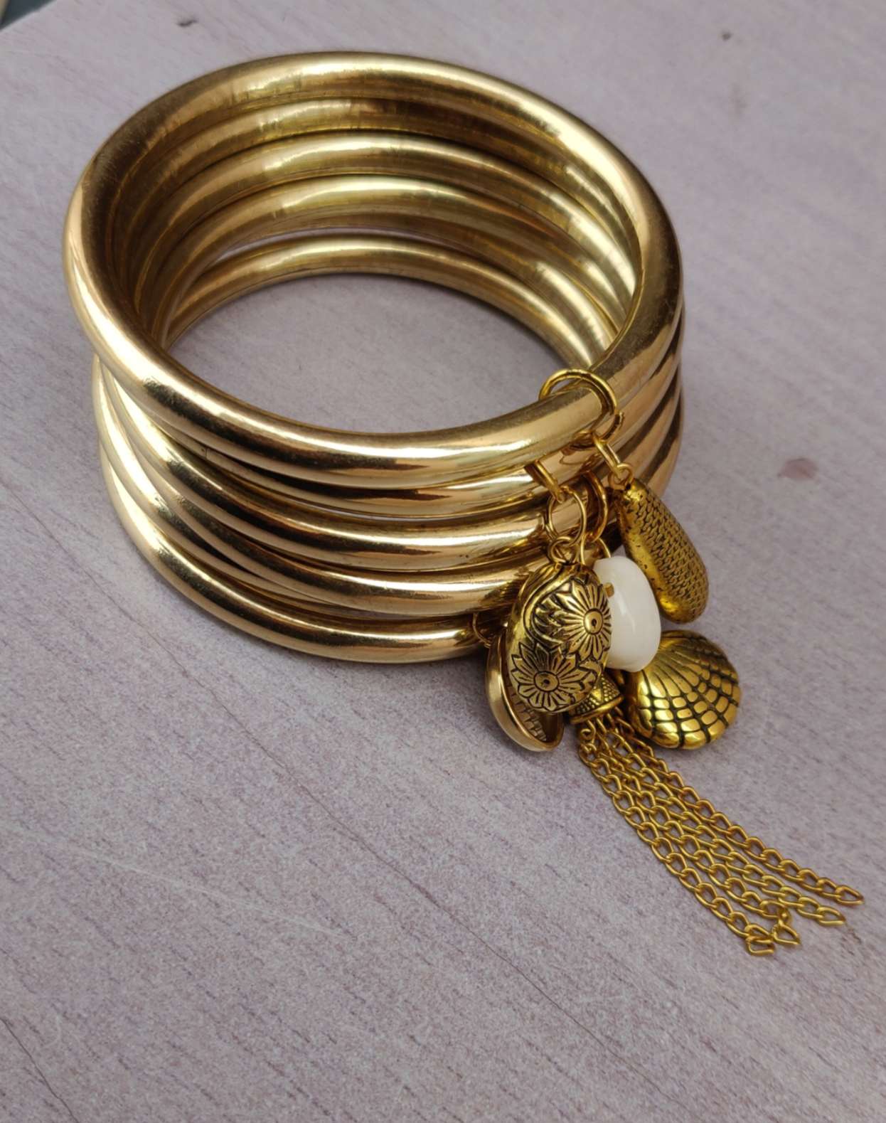 Golden Charm Bangles Set – Boho Chic with Shell & Tassel Accents (Set of 6)
