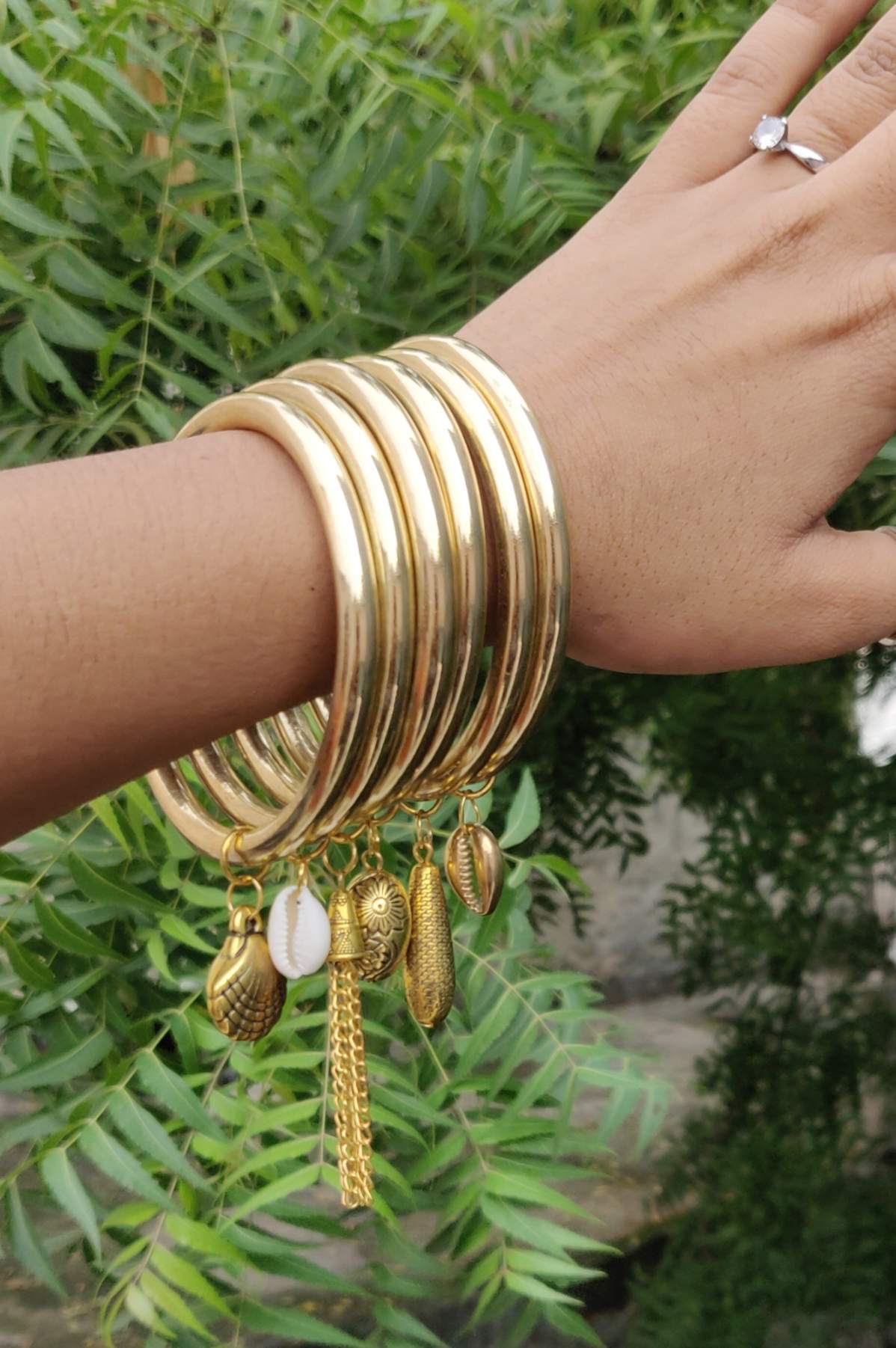 Golden Charm Bangles Set – Boho Chic with Shell & Tassel Accents (Set of 6)