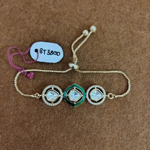 Statement kundan bracelet with emerald centerpiece, regal Indian ethnic accessory