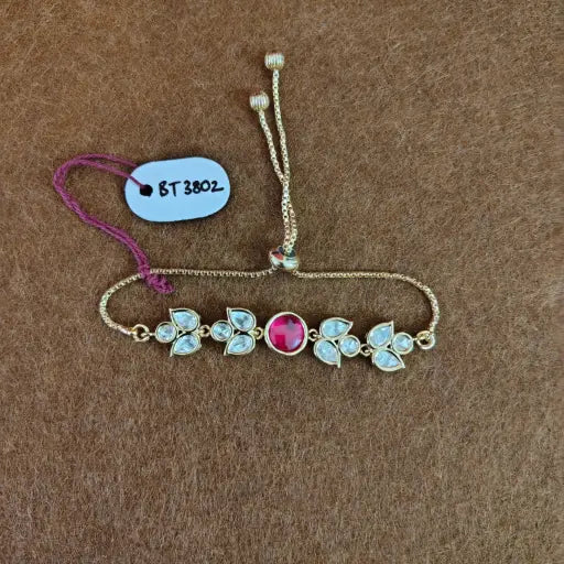 Floral kundan bracelet with ruby pink center, handcrafted festive Indian jewelry