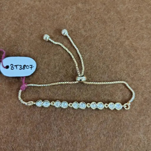 Tiny kundan crystal line bracelet in soft gold, elegant lightweight jewelry for everyday use