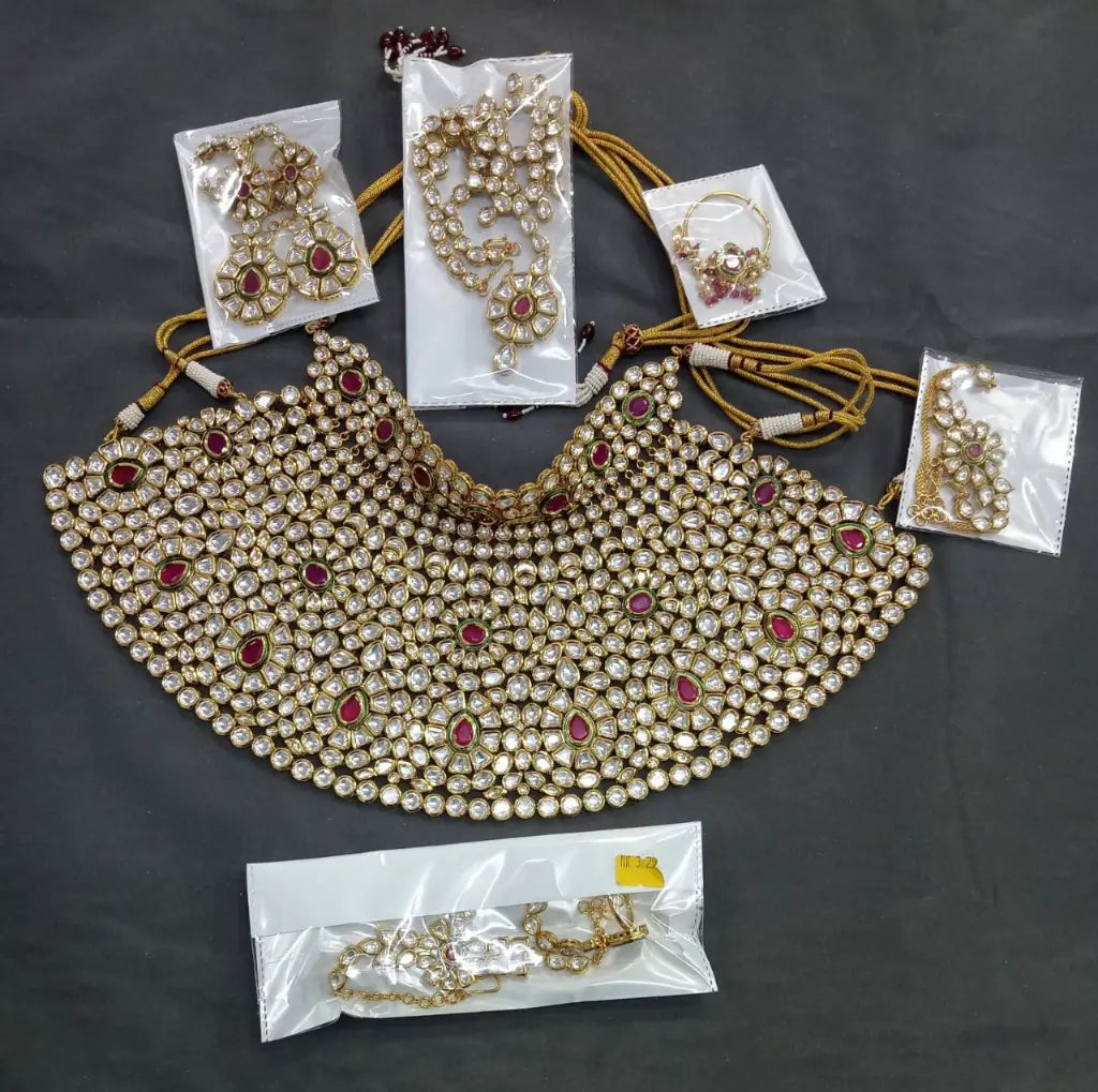 Timeless ruby teardrops on a classic gold backdrop.