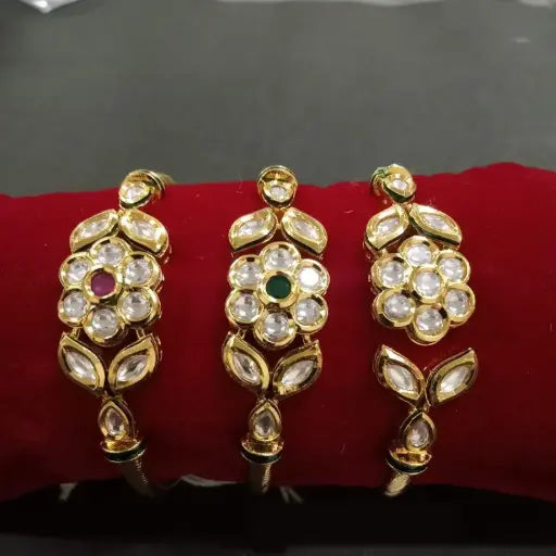 AIVY LUXE classic kundan bangles set with gold plating and intricate stonework on red display