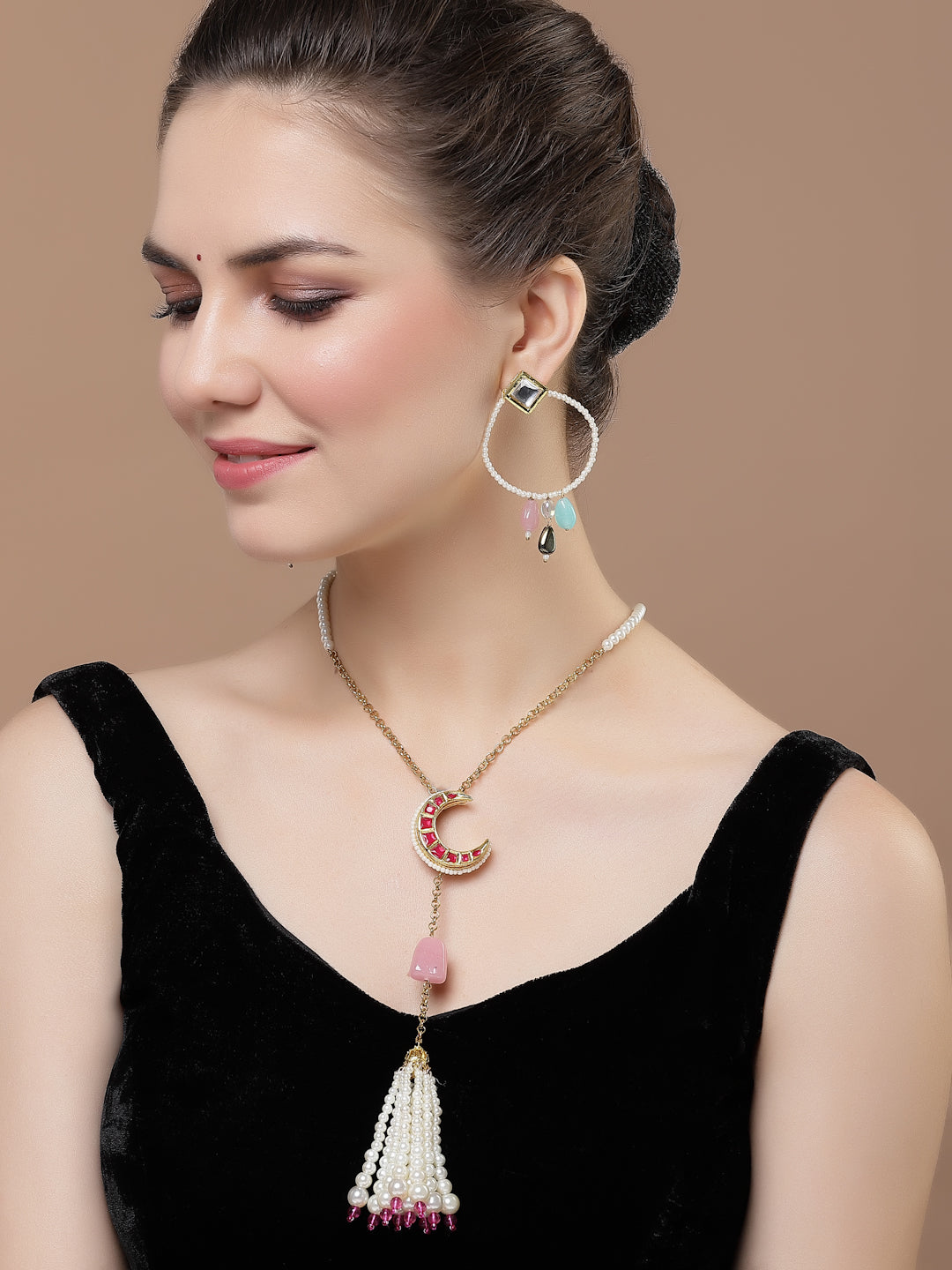AIVY LUXE designer crescent moon earrings worn by woman with elegant black dress and matching necklace