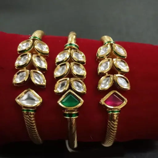 AIVY LUXE elegant dual tone kundan bangles with clear and colored gemstones on red velvet