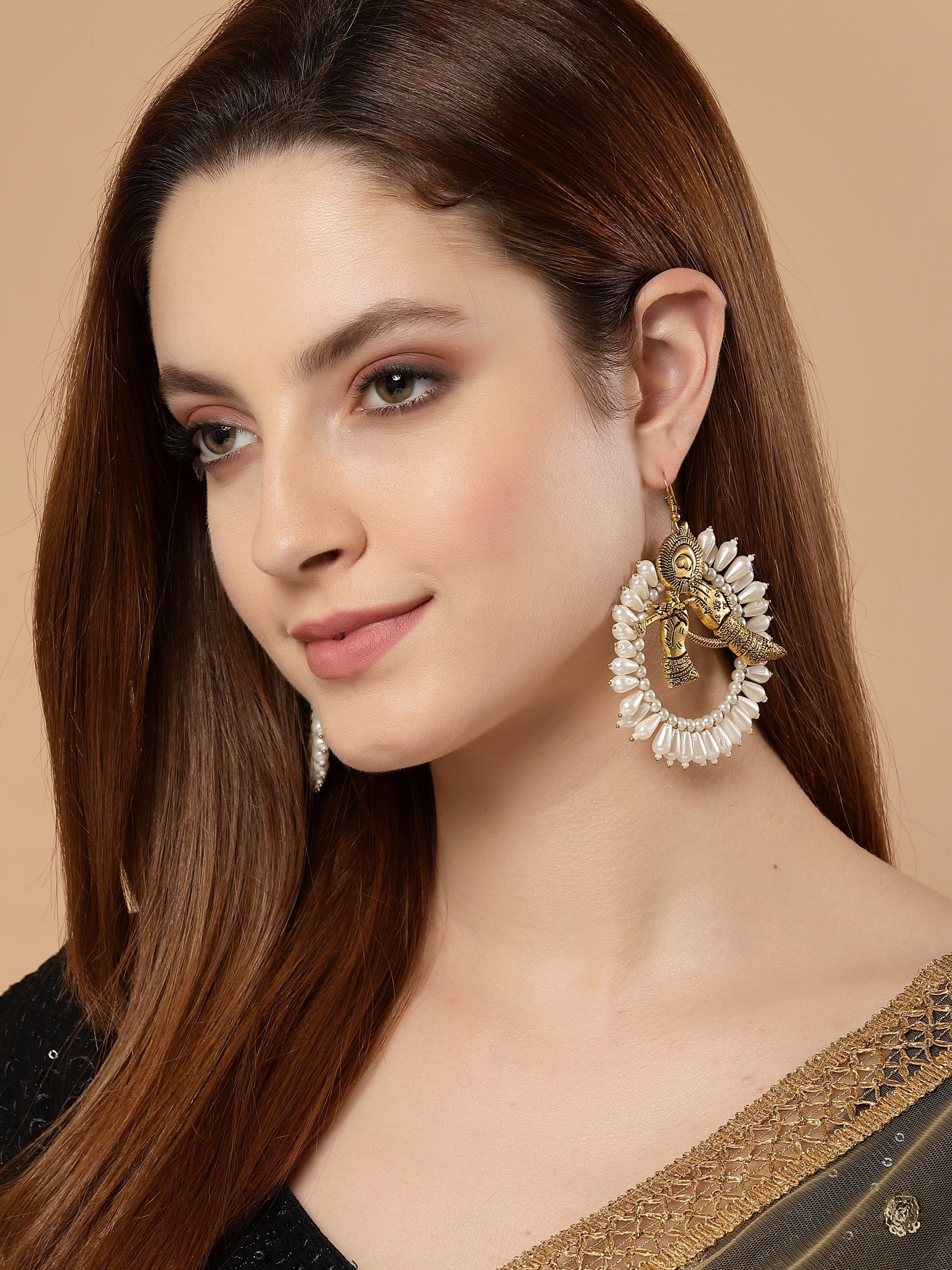 AIVY LUXE gold moon hoop earrings worn by a woman with long brown hair and neutral makeup