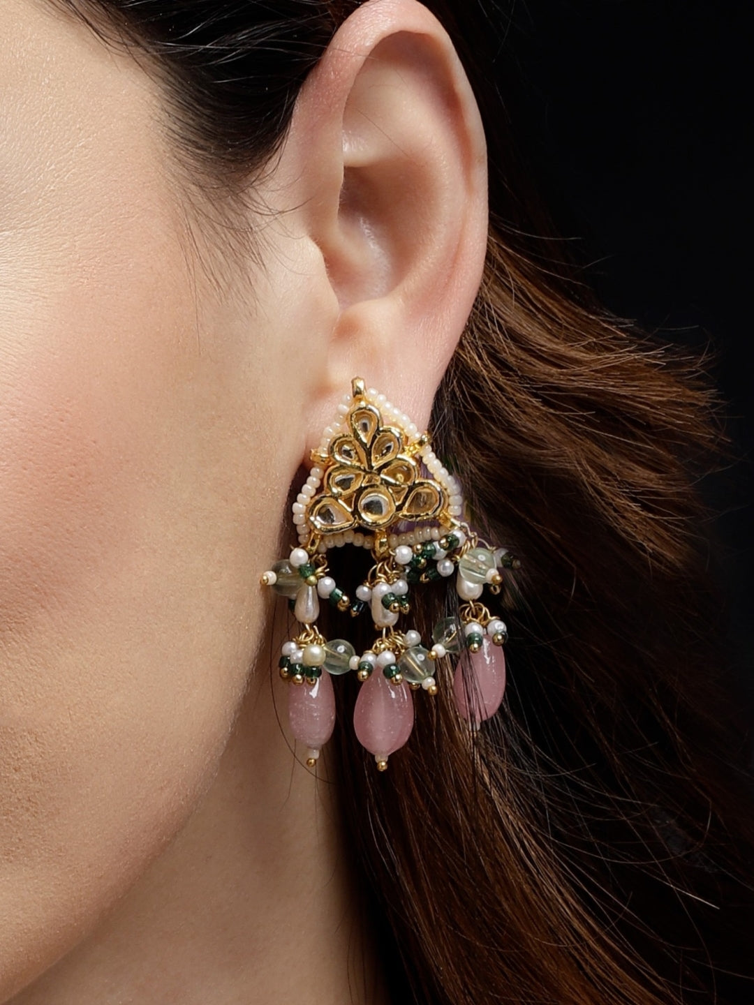 AIVY LUXE Gulshan Sitara statement earrings with intricate gold design and pink bead dangles worn on ear