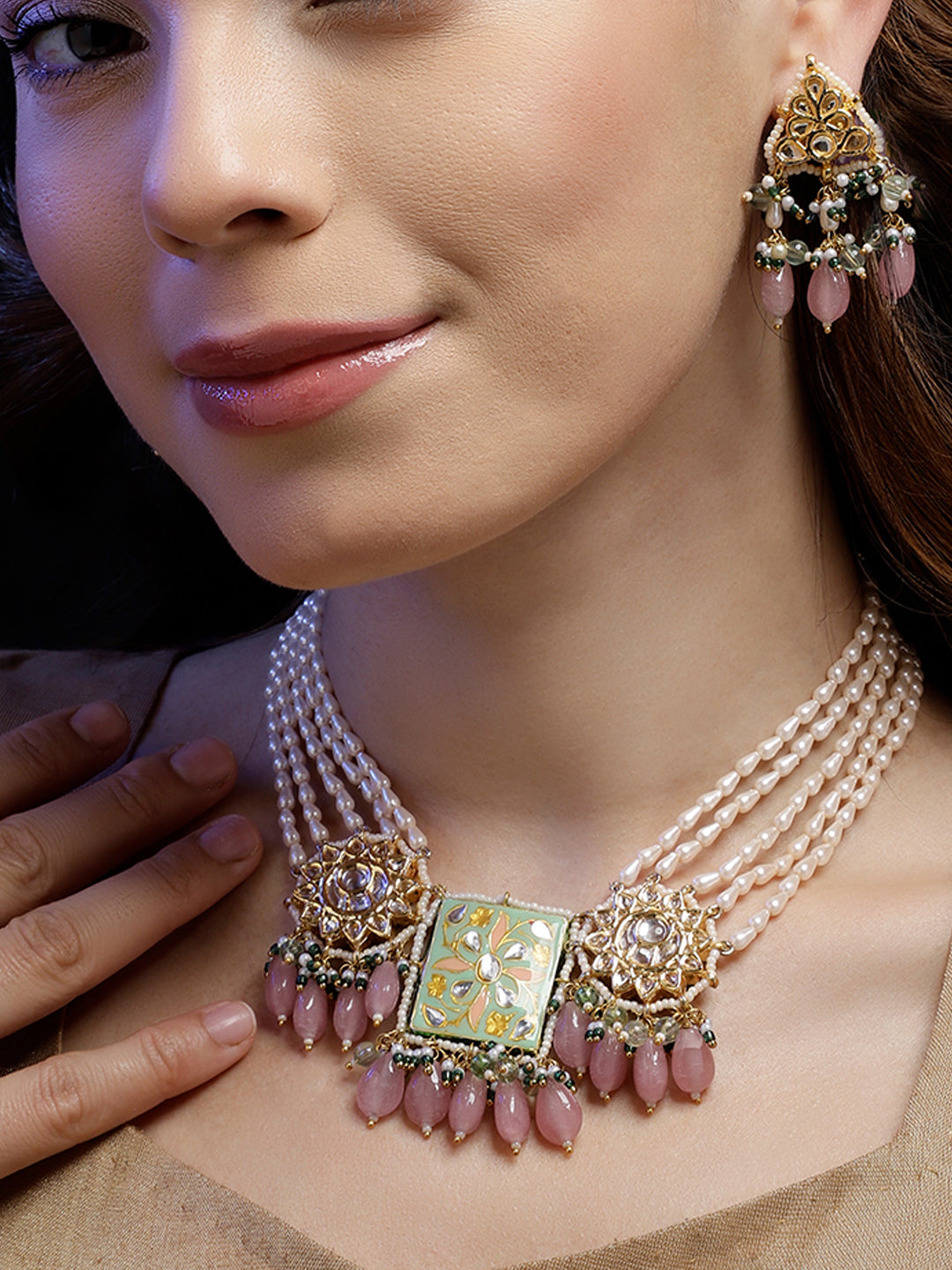 Handcrafted sahrai noor necklace with multi-strand pearls and intricate gold and pink gemstone pendant