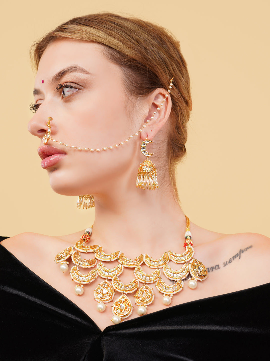 AIVY LUXE Indian bridal jewelry set featuring a gold necklace with pearl accents and matching earrings
