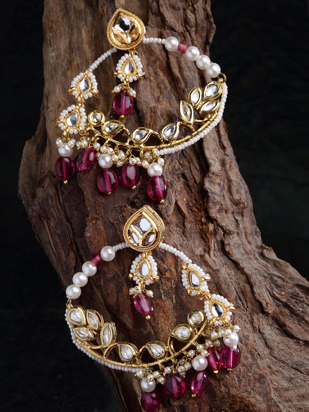 AIVY LUXE kundan embellished hoop earrings with gold detailing, white pearls, and red beads on rustic wood