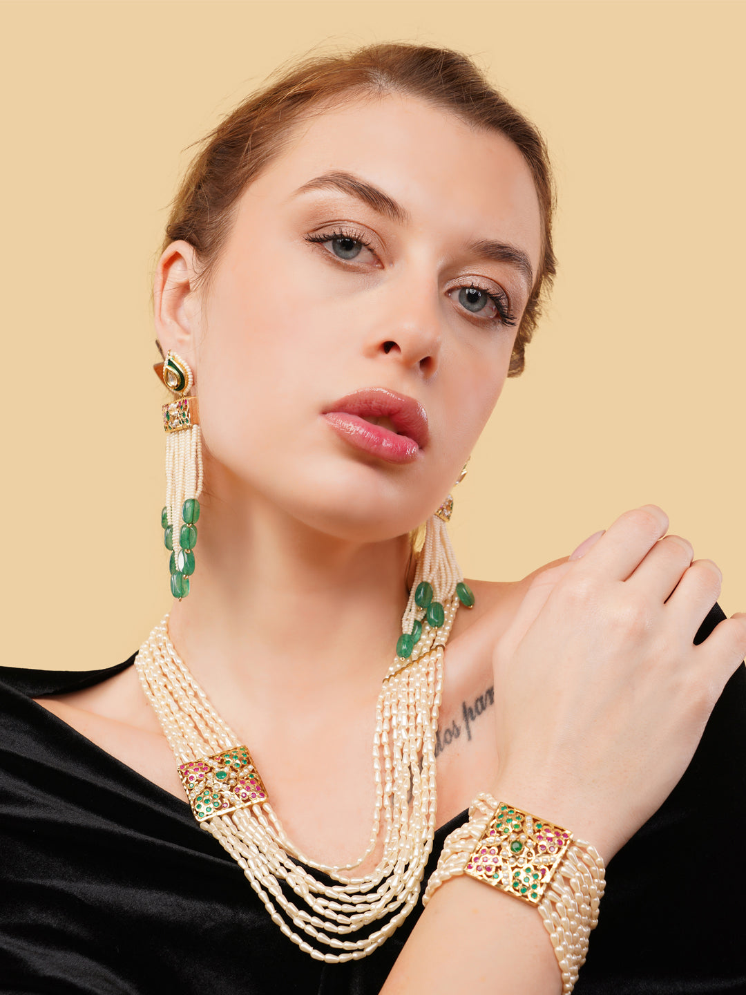 Luxury Indian necklace with pearls by AIVY LUXE featuring multi-strand pearls and green gemstone accents