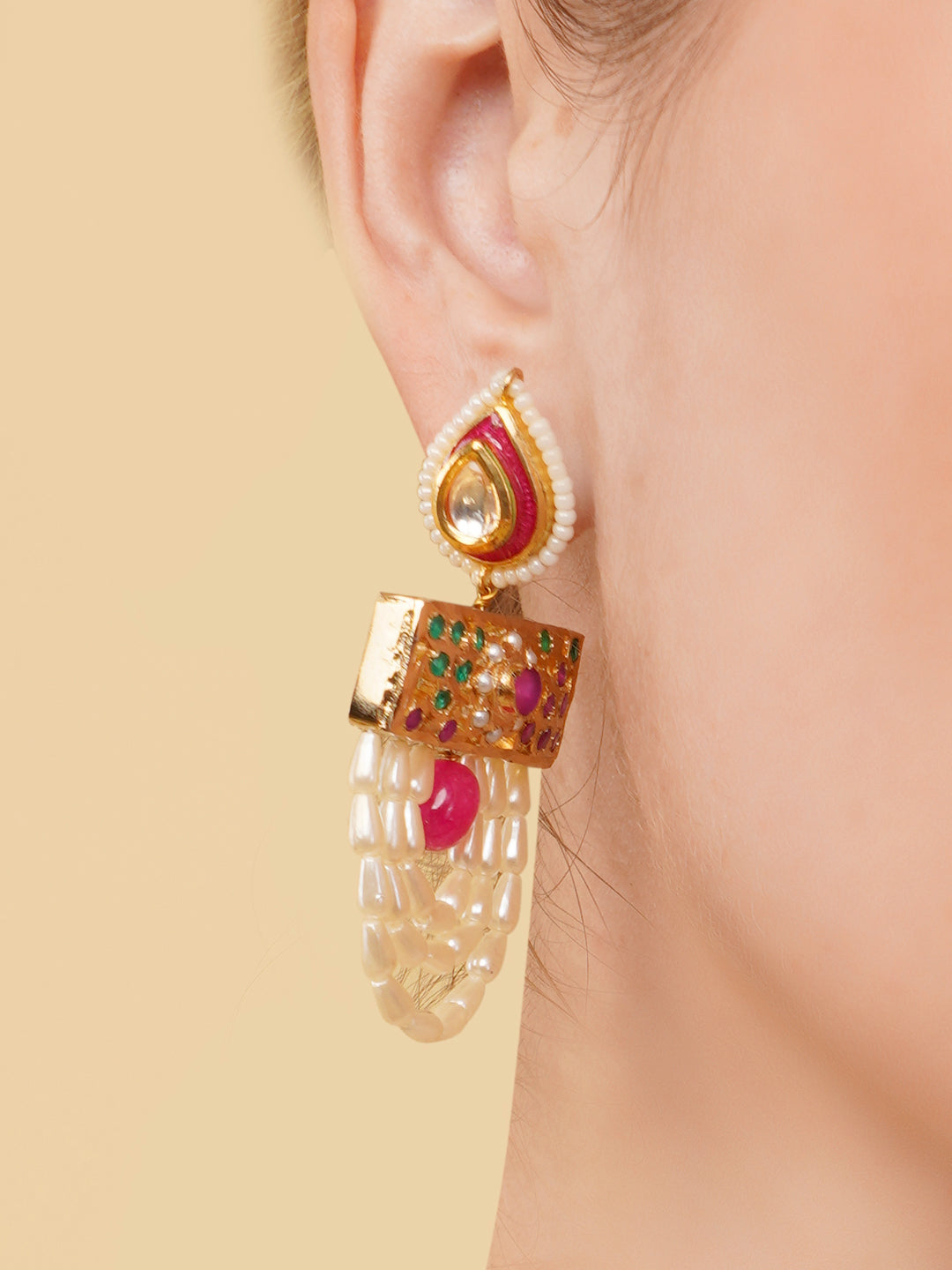 AIVY LUXE pearl embellished drop earrings featuring gold, red, and green accents worn on ear