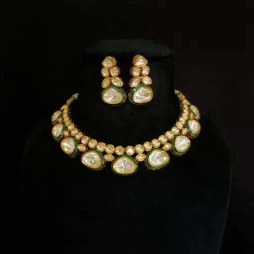 AIVY LUXE Polki necklace set featuring gold tone and pearl detailing with matching earrings on black display