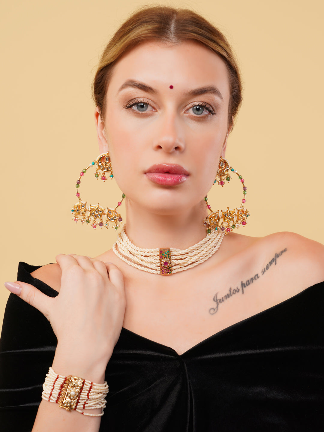 Woman wearing Rang-e-Gul designer earrings by AIVY LUXE with pearl choker and bracelet set