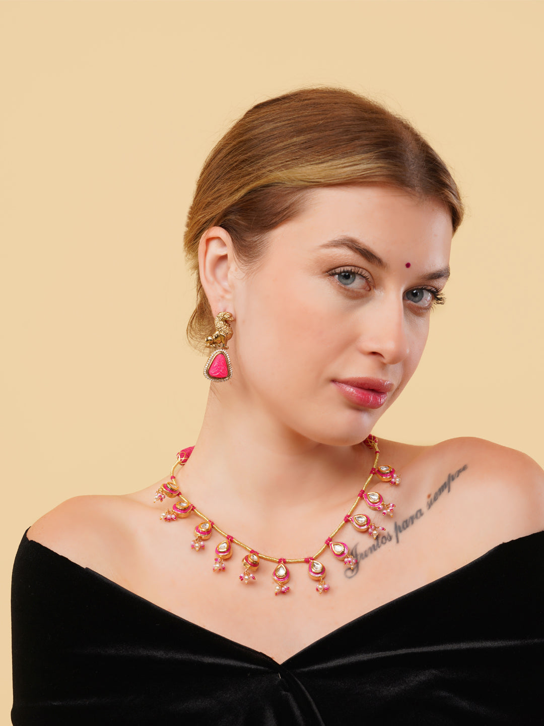AIVY LUXE statement pink gemstone necklace worn by a woman with matching earrings and black off-shoulder top