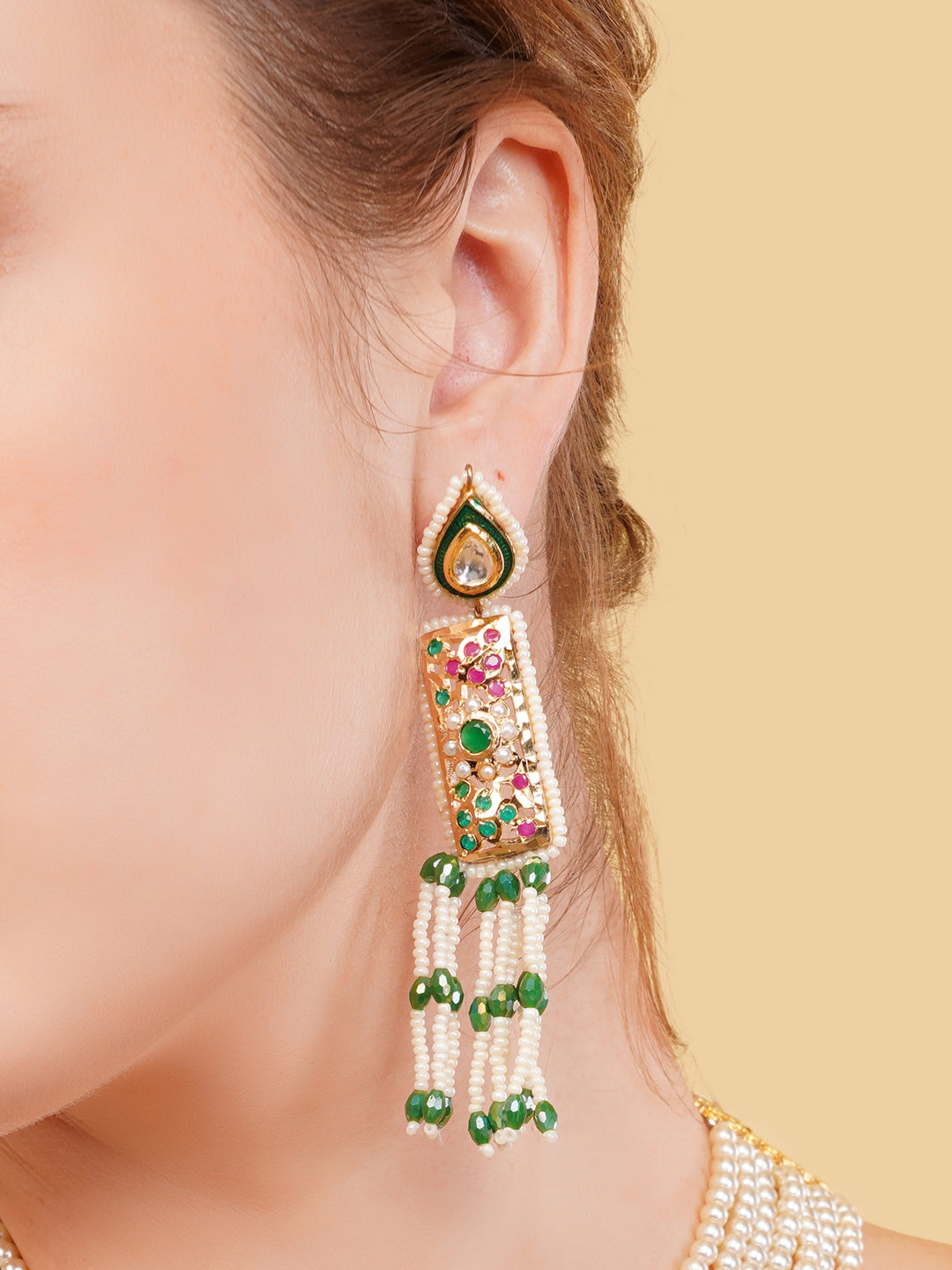 AIVY LUXE stunning pearls drop earrings with green and gold detailing on a model