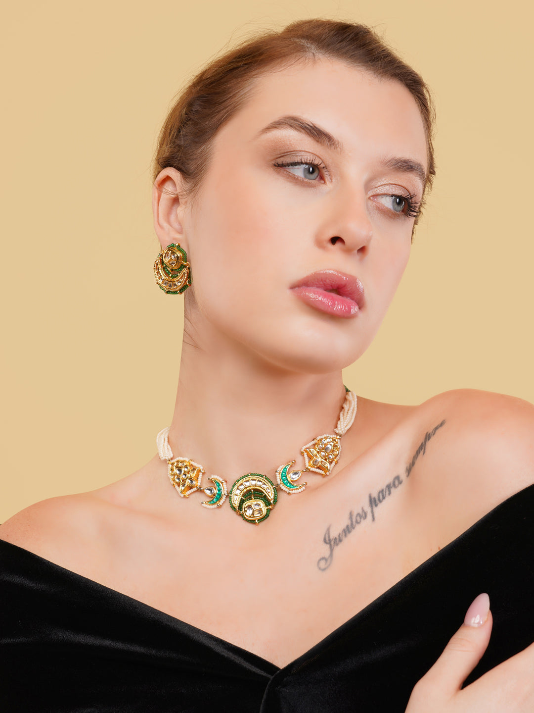 AIVY LUXE green gold statement jewelry set featuring a necklace and matching earrings worn by a woman