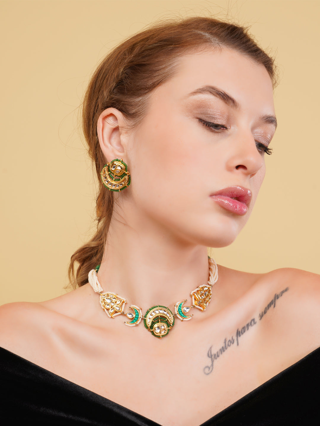 AIVY LUXE green gold statement jewelry set featuring a detailed necklace and matching earrings on a model