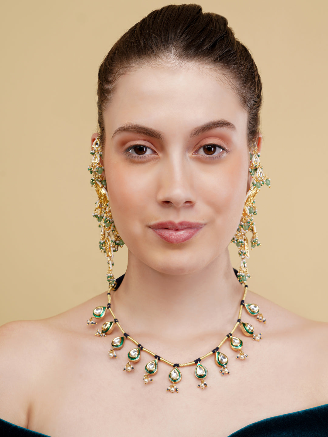 AIVY LUXE luxury Indian necklace for women with green and gold detailing worn by model