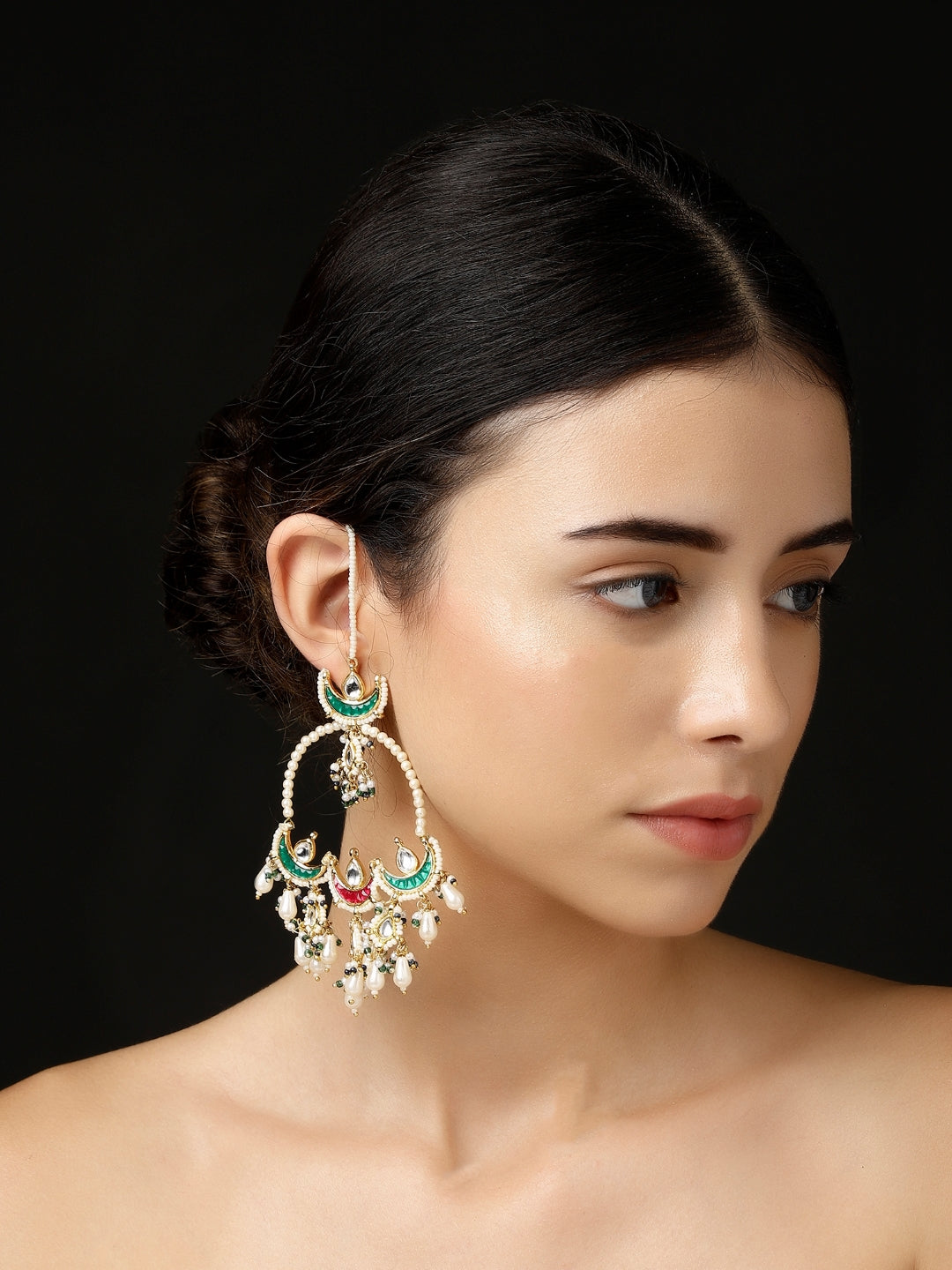 AIVY LUXE Shafaq-e-Laal drop earrings worn by a model featuring intricate green and red designs with pearl accents