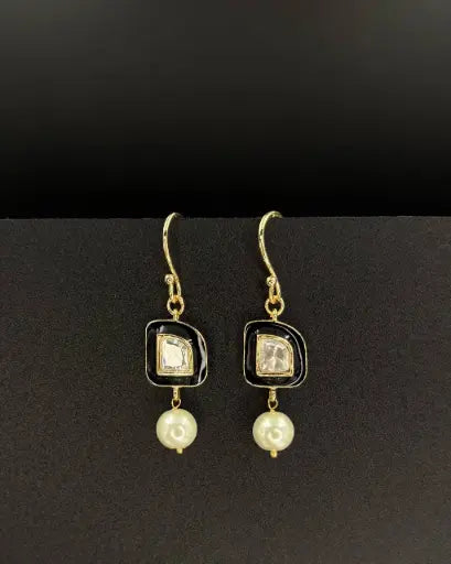 Small floral earrings with subtle charm