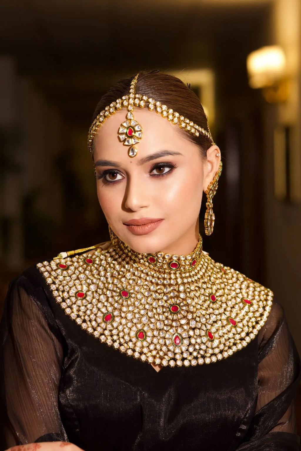 Timeless ruby teardrops on a classic gold backdrop.