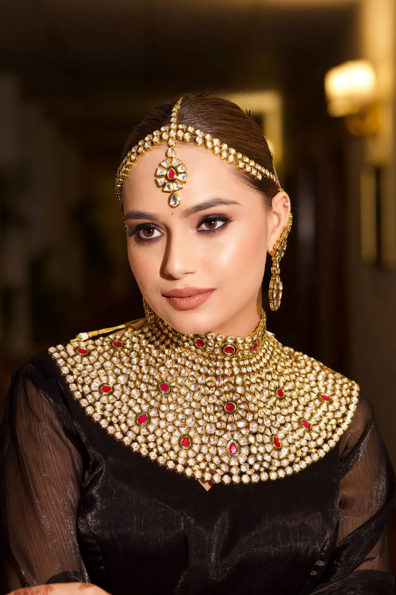 Timeless ruby teardrops on a classic gold backdrop.
