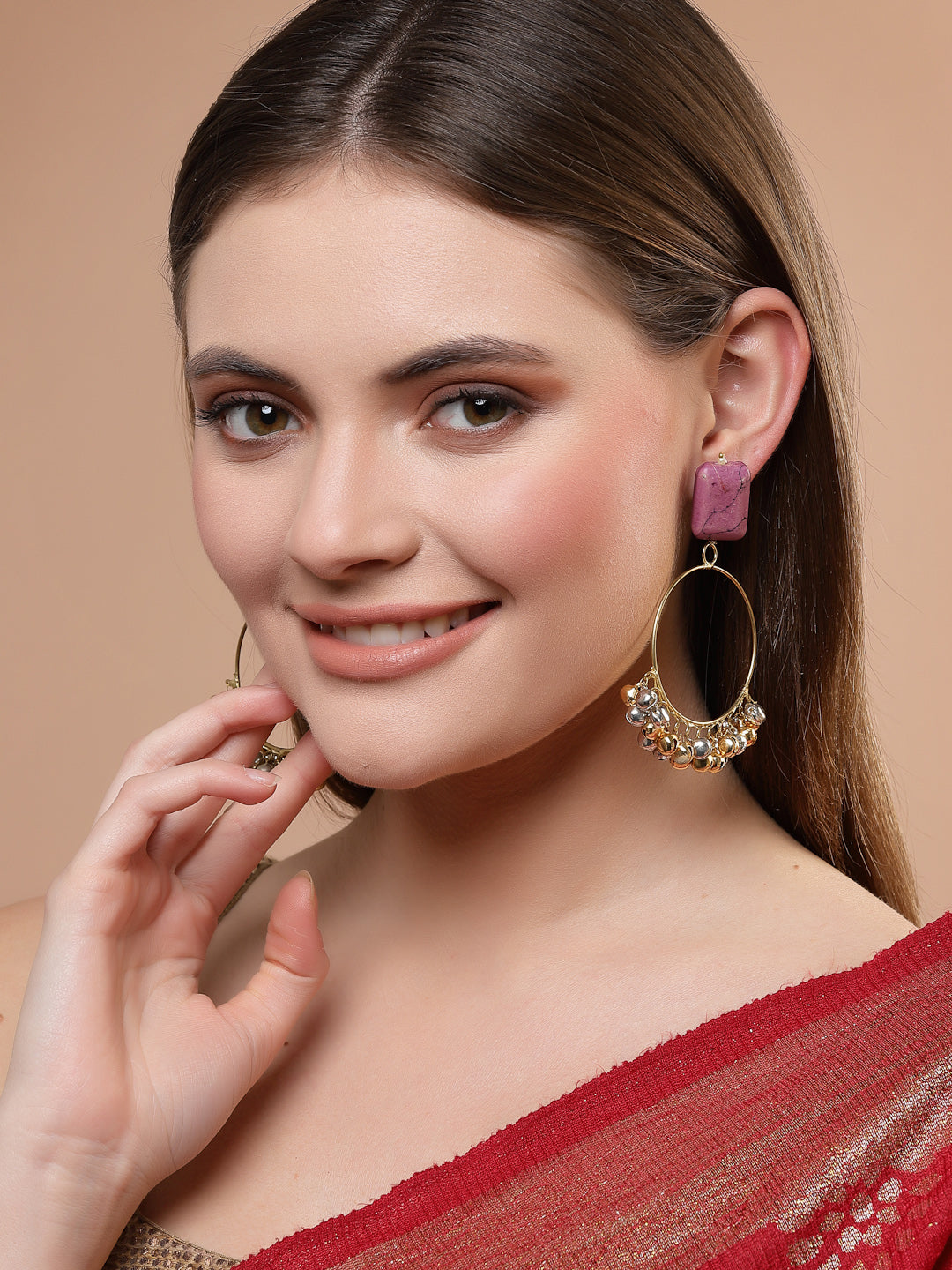 AIVY LUXE amaranth chand bala earrings worn by a woman with a red and gold saree