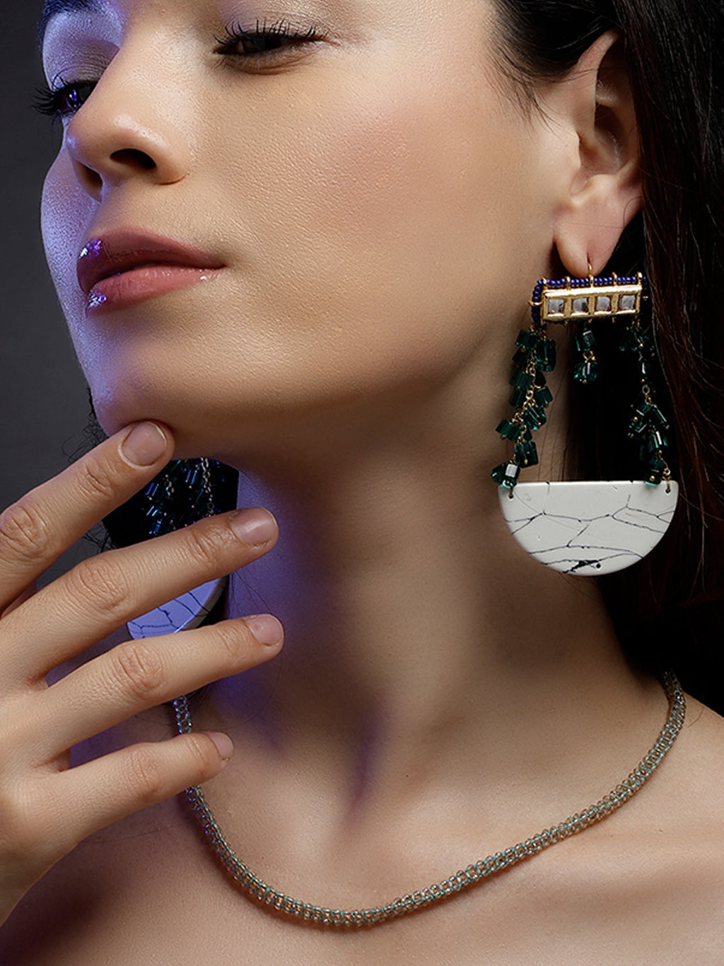 AIVY LUXE artisan statement layered necklace worn on a woman with focus on the elegant chain and modern earrings