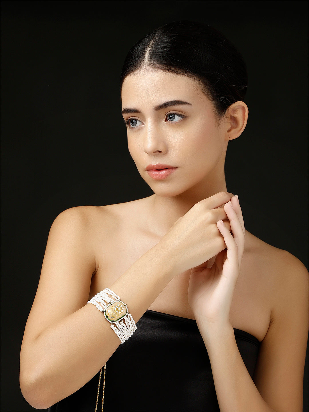 AIVY LUXE artisanal beaded jewelry for women worn as a stylish white beaded bracelet on model’s wrist