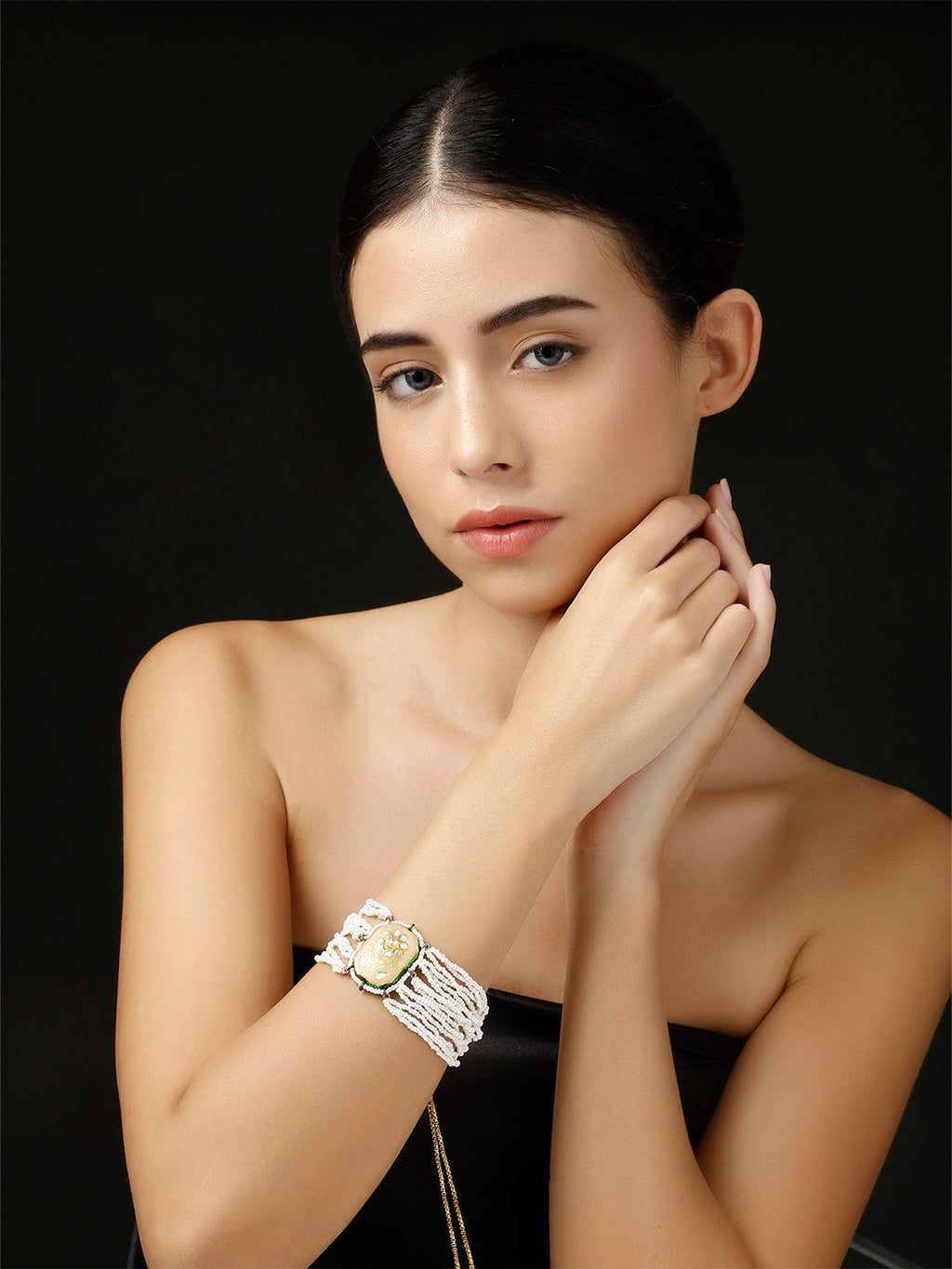 AIVY LUXE artisanal beaded jewelry for women featuring a white beaded bracelet with a decorative centerpiece