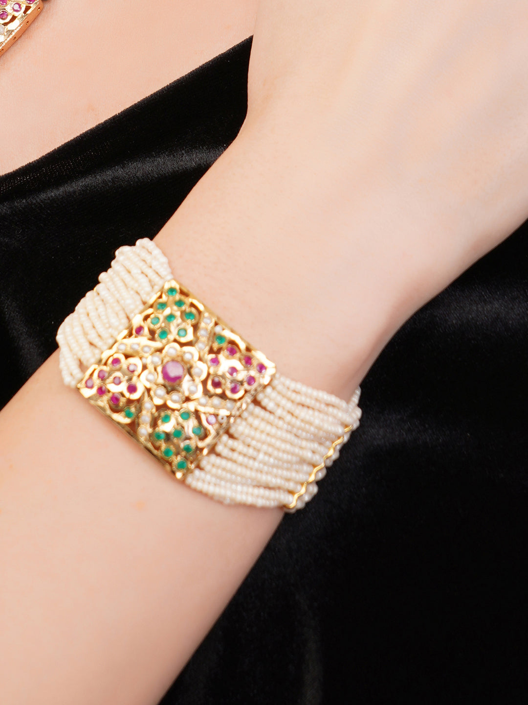 AIVY LUXE beautiful pearl bracelet with gold and colorful gemstone centerpiece on wrist