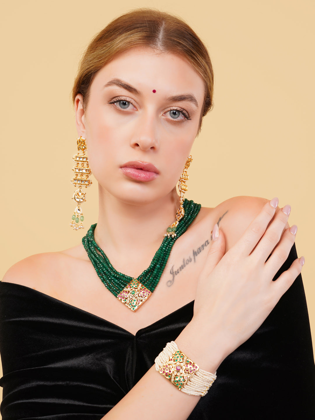 AIVY LUXE Beautiful Pearl bracelet worn by model with gold and green jewelry accessories