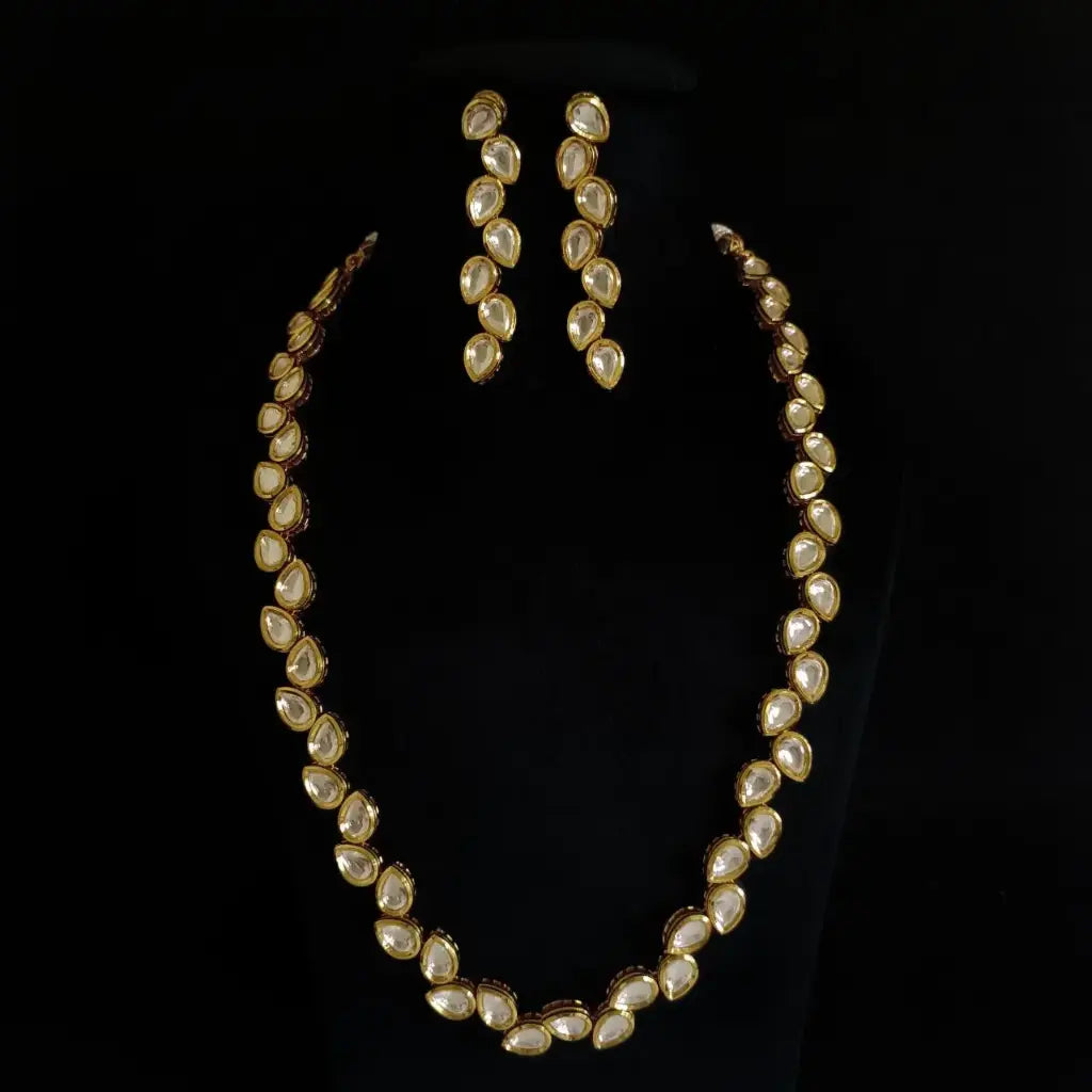 AIVY LUXE bridal kundan necklace with earrings featuring gold settings and teardrop white stones