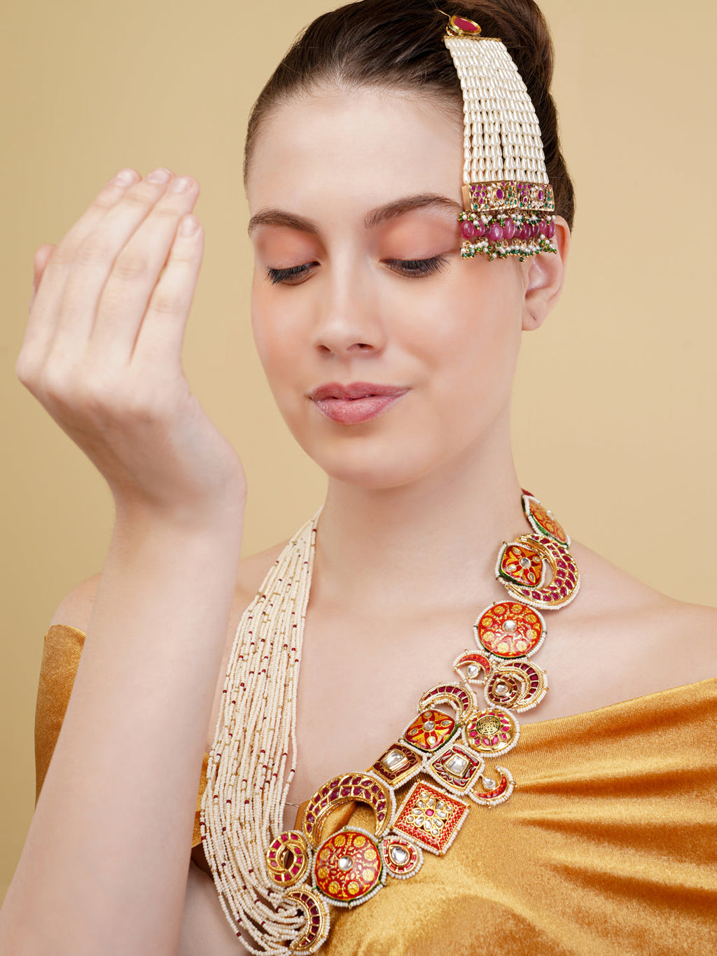 AIVY LUXE bridal zarqaani haar necklace with intricate gold and red detailing worn by a woman