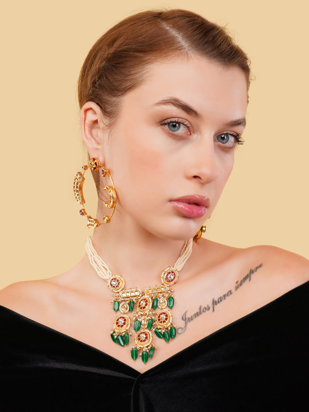 AIVY LUXE Chand Bala multicolour earrings worn by a woman with matching necklace on beige background