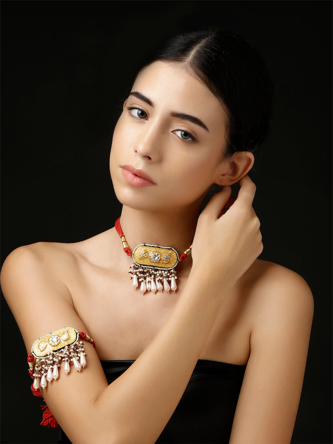 AIVY LUXE contemporary Indian arm jewelry bajubandh with intricate design and pearl details on model