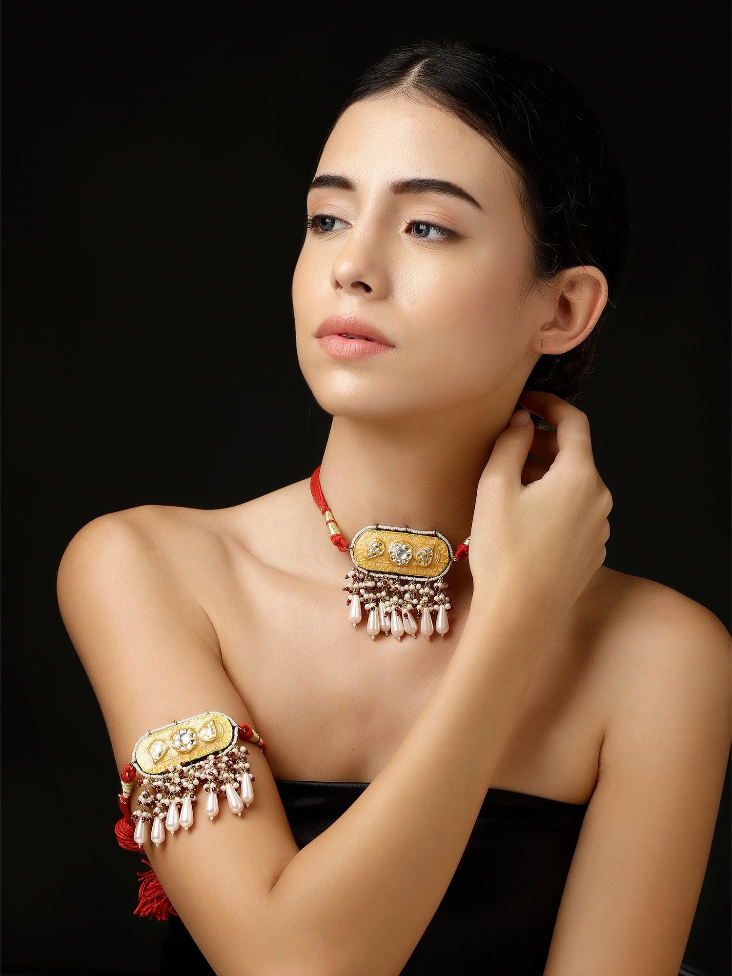 AIVY LUXE bajubandh on woman featuring contemporary Indian arm jewelry with gold and pearl details