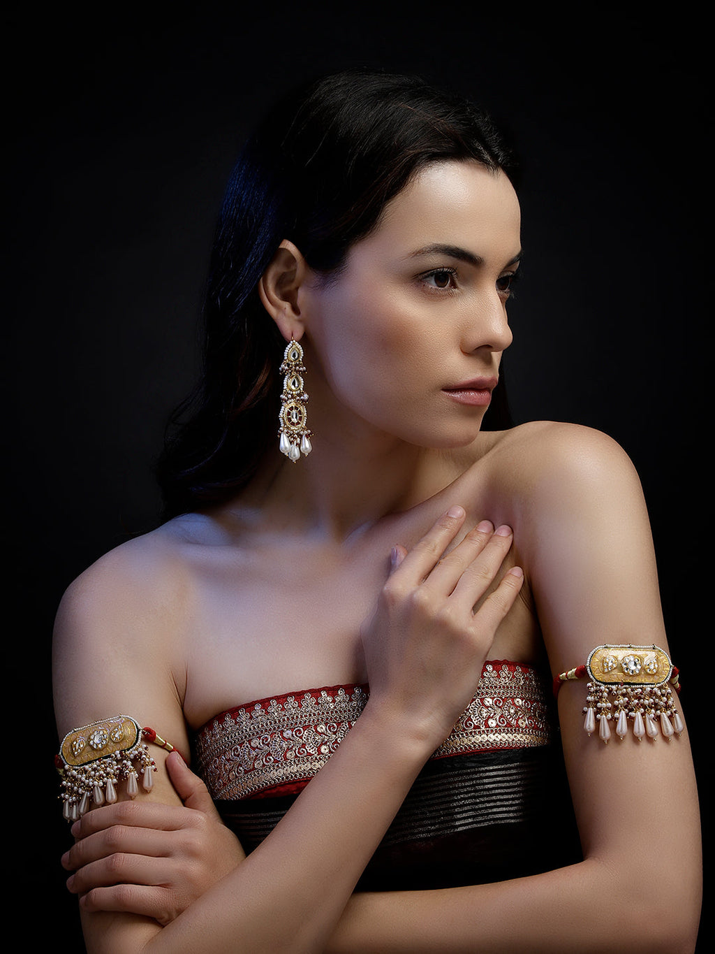 AIVY LUXE fusion jewelry earrings worn by model featuring intricate gold design with dangling pearls