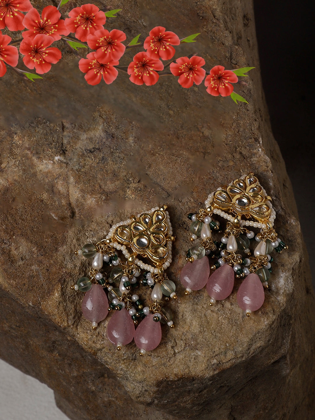 AIVY LUXE Gulshan Sitara statement earrings with gold detailing and pink teardrop beads on rustic stone