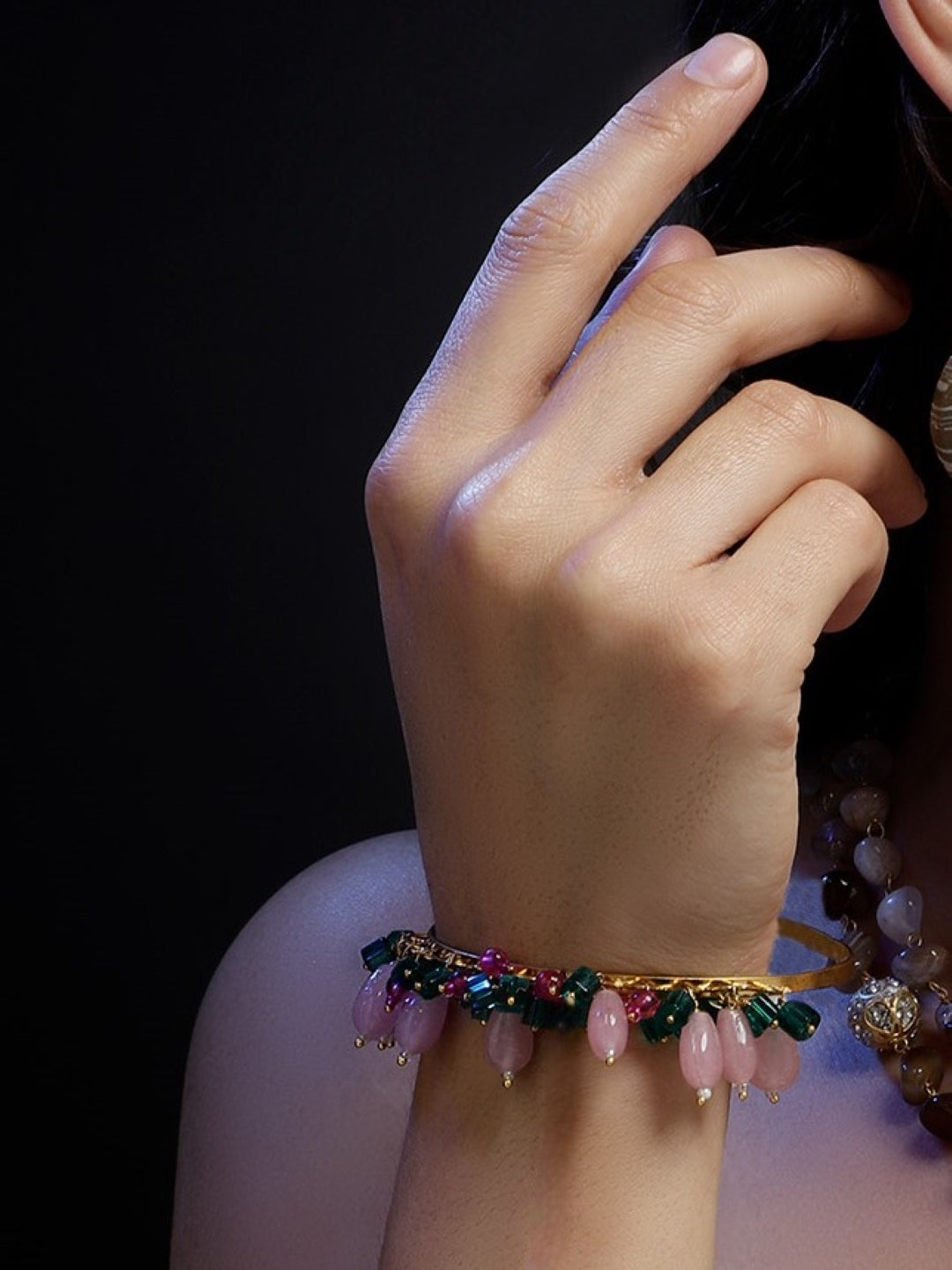 AIVY LUXE handcrafted bracelet for women with pink and green beads on a woman’s wrist