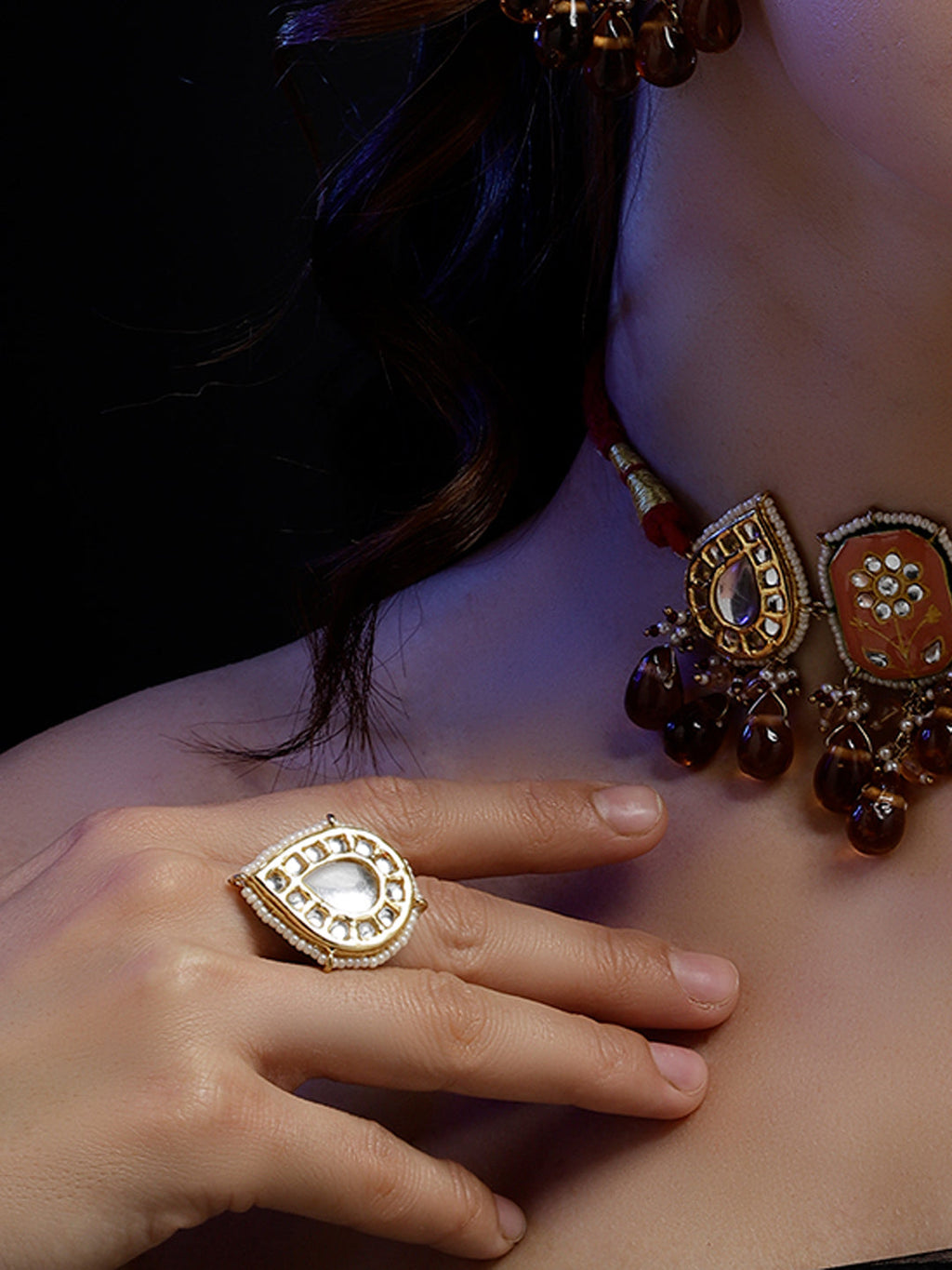 AIVY LUXE handcrafted charm ring with intricate gold design worn on finger with matching necklace