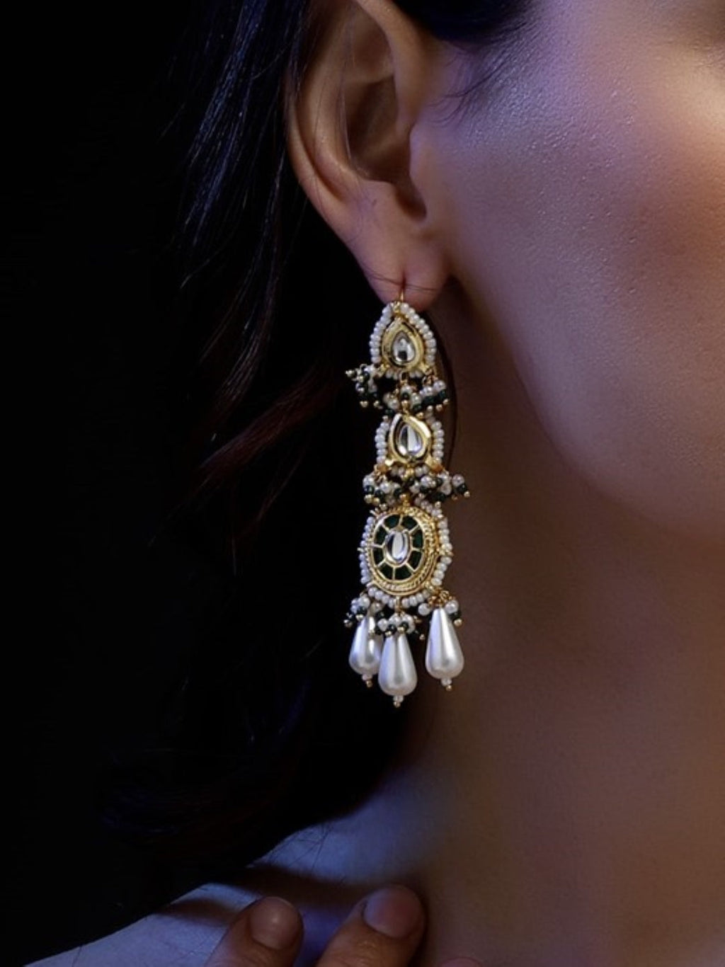 AIVY LUXE handcrafted drop earrings with intricate gold detailing and pearl accents worn on ear