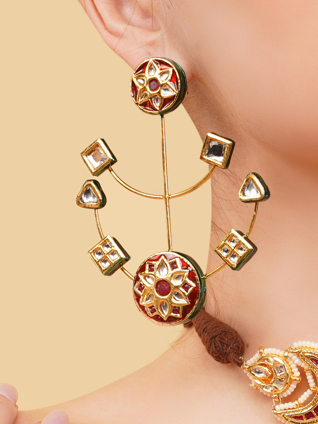 AIVY LUXE heritage style drop earrings with intricate gold and red floral design worn on ear
