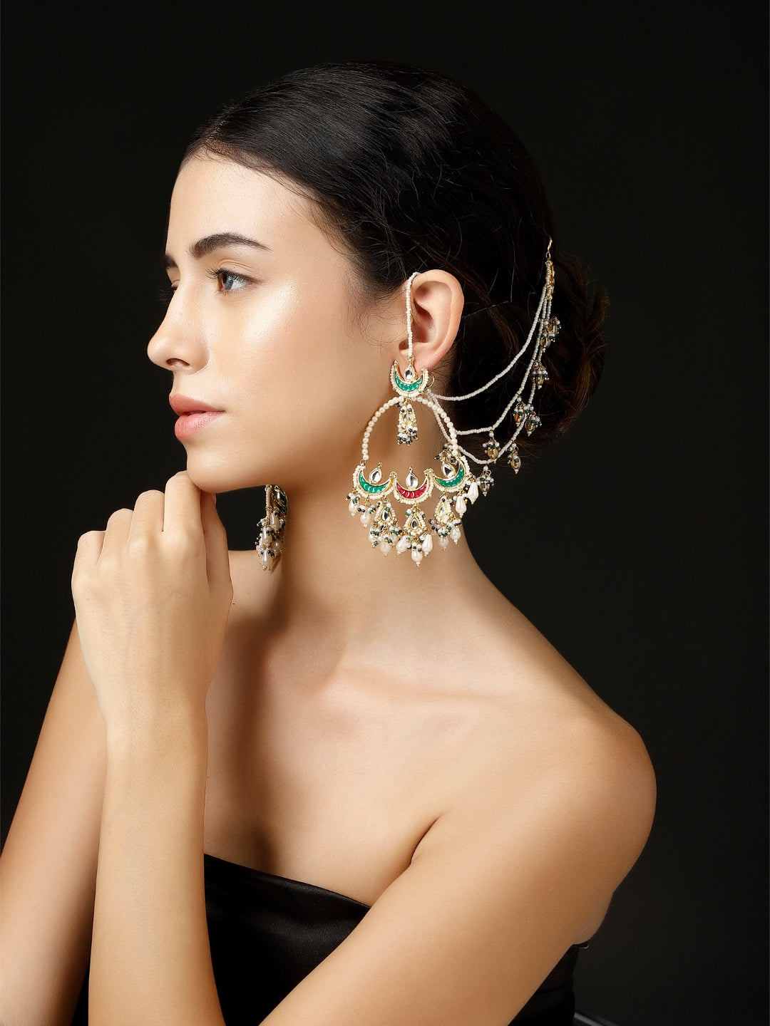 Elegant model wearing Husn-e-Arq Kanchain earrings by AIVY LUXE with green and pink accents
