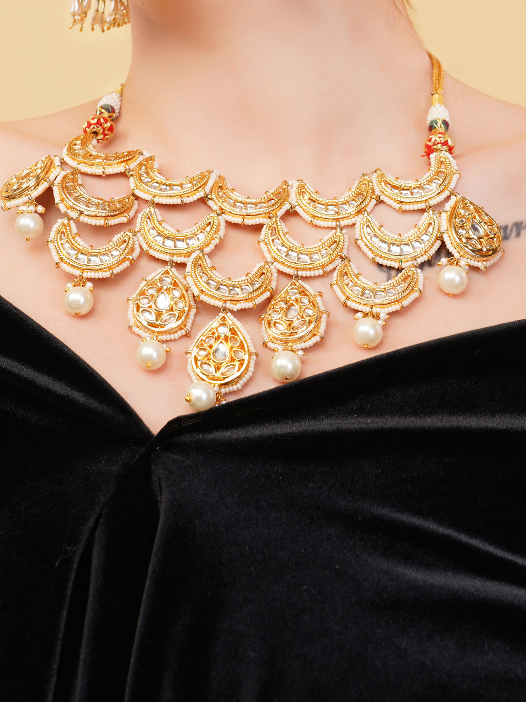 AIVY LUXE Indian bridal jewelry set with gold and pearl detailed necklace on model