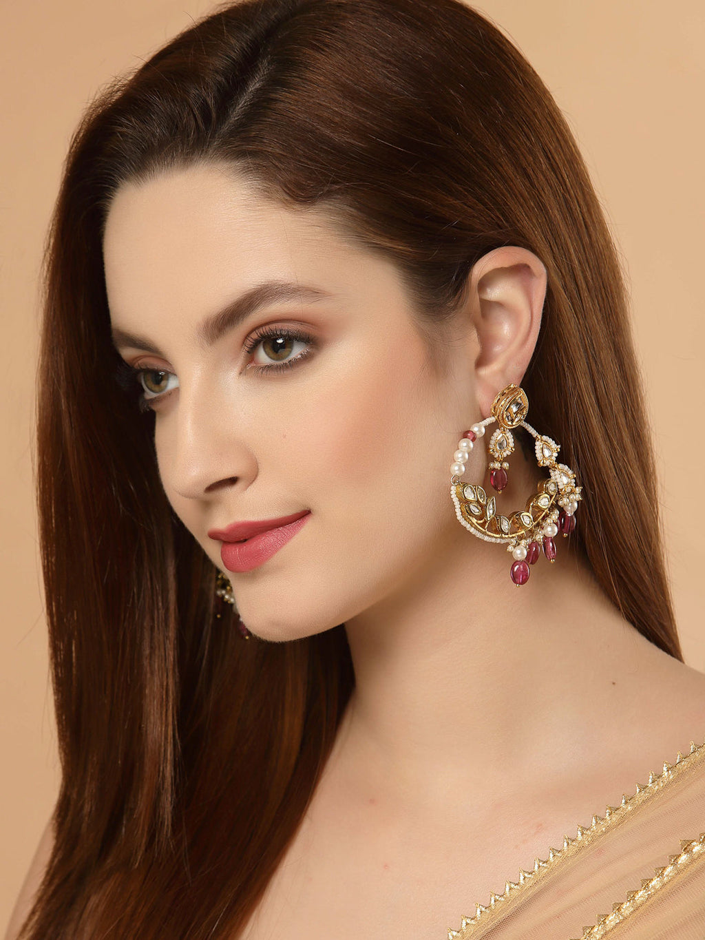 AIVY LUXE kundan embellished hoop earrings worn by woman with long brown hair and gold outfit