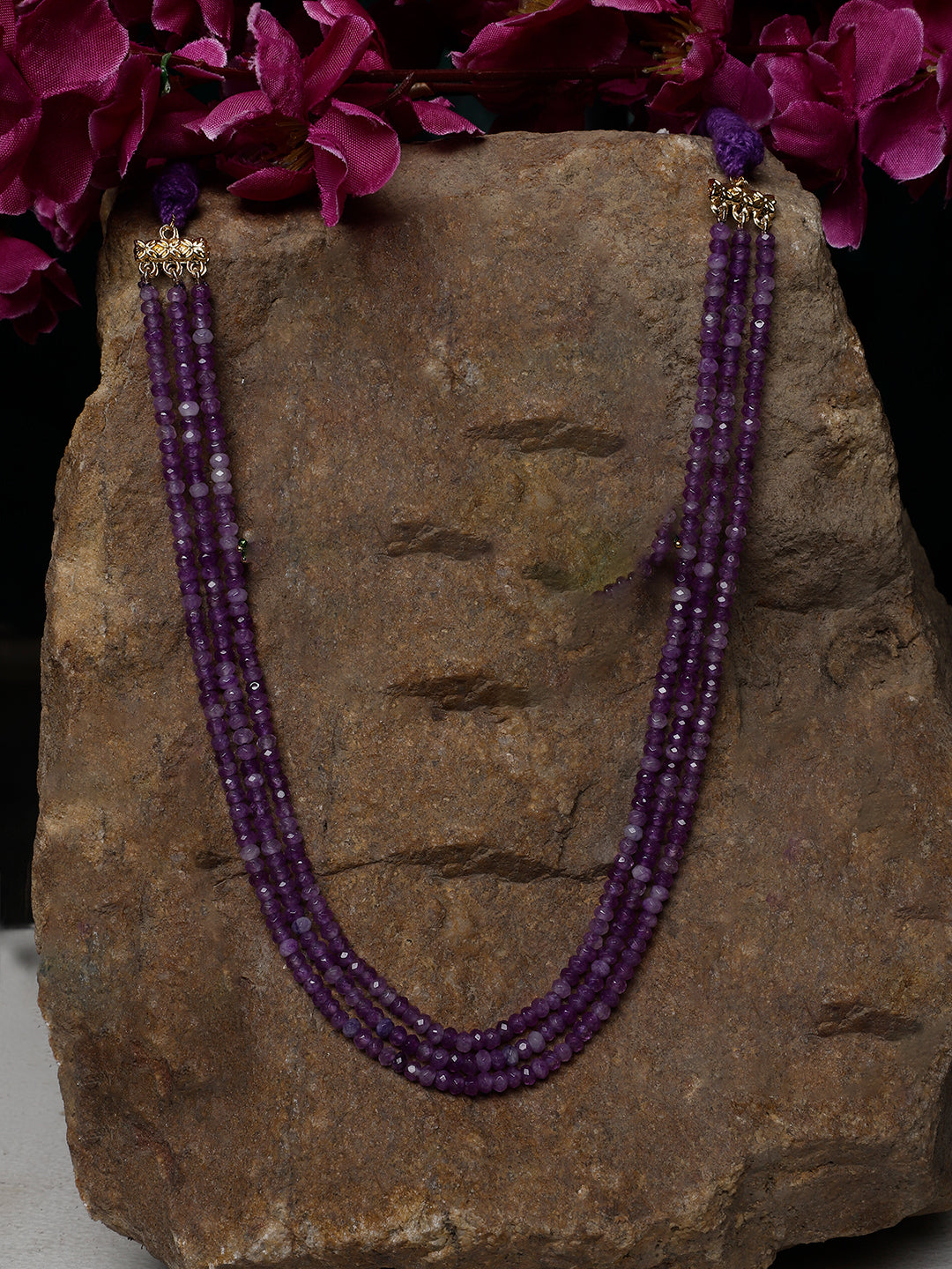 AIVY LUXE layered charm necklace featuring multiple strands of purple beads with gold accents