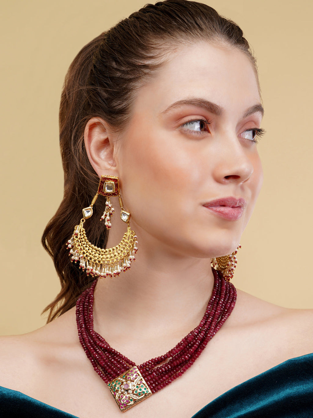 AIVY LUXE necklace with multiple strands of red beads and a decorative clasp showcasing luxury beaded jewelry