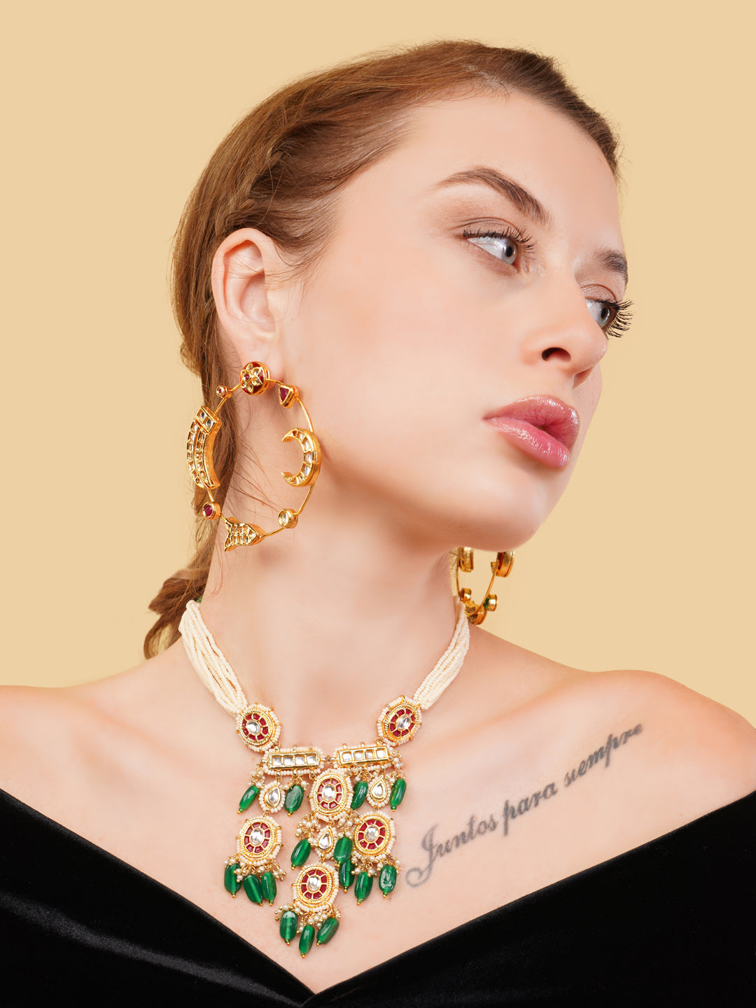 AIVY LUXE luxury ethnic gemstone necklace with green stones worn by model with matching earrings